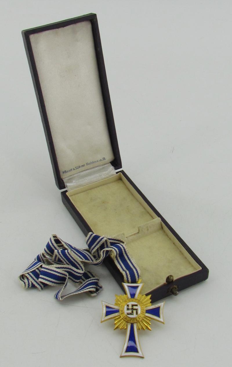 Mother’s cross in gold with box ( Klamt und Söhne )